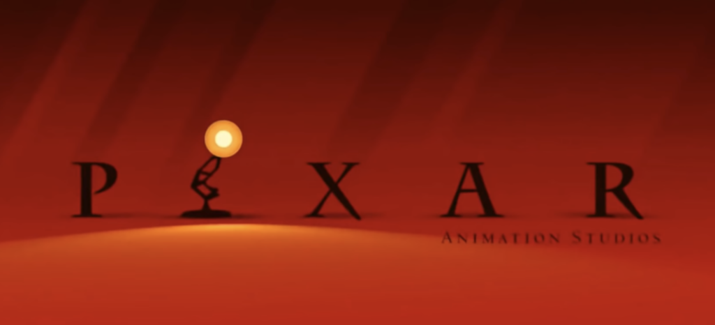 Pixar logo variation with Luxo Jr. casting a warm orange light on a red background, inspired by the Incredibles' iconic color scheme.